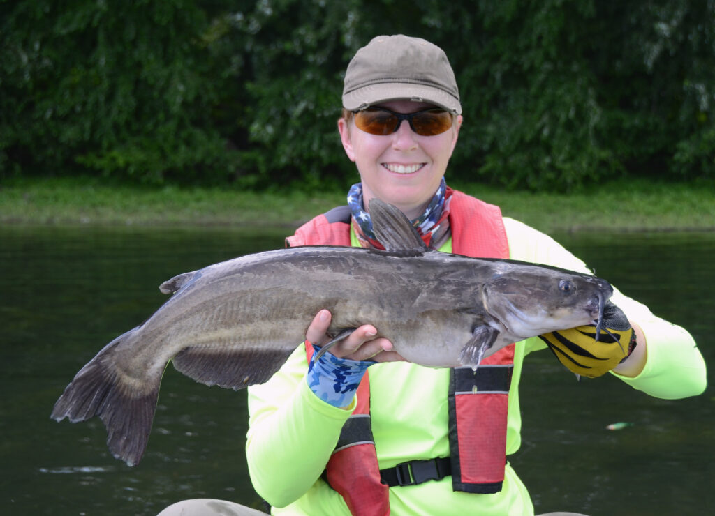 woman holding a big channel catfish